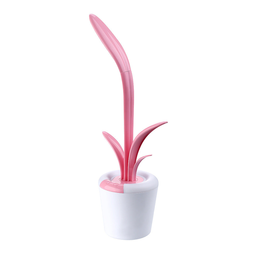 Pink and white cleaning brush with a cylindrical holder on a white background