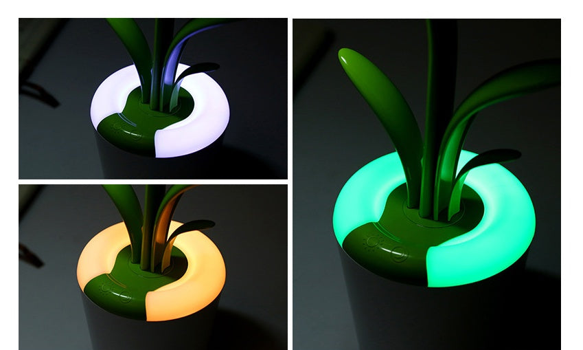 Glowing plant pot with changing colors on a dark background